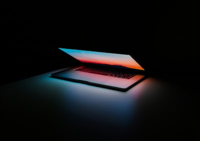 Tech workspace with laptop and digital elements